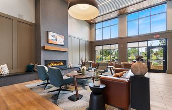 Resident lounge with kitchen, dining space and fireplace